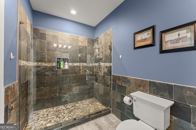 1572 Azalea Dr, Lawrenceville, GA 30043 - full bathroom with tile walls, tiled shower, and a wainscoted wall