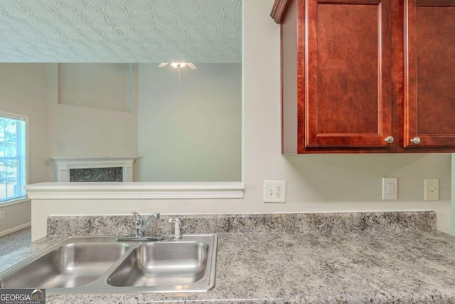 513 Shadow Valley Ct, Lithonia, GA 30058 - kitchen view of light countertops and a fireplace