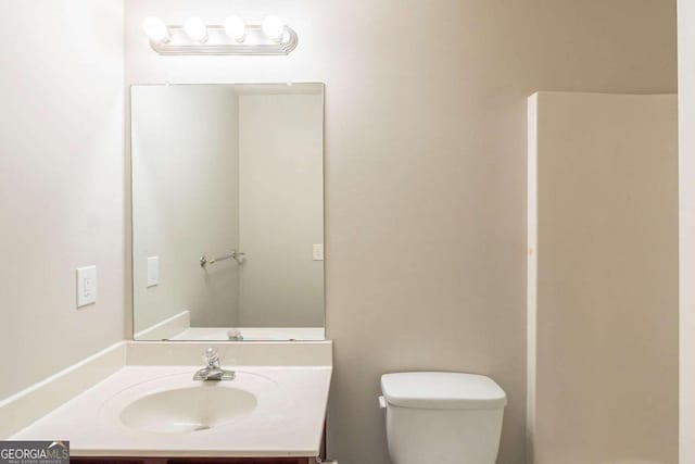 513 Shadow Valley Ct, Lithonia, GA 30058 - bathroom featuring toilet and vanity