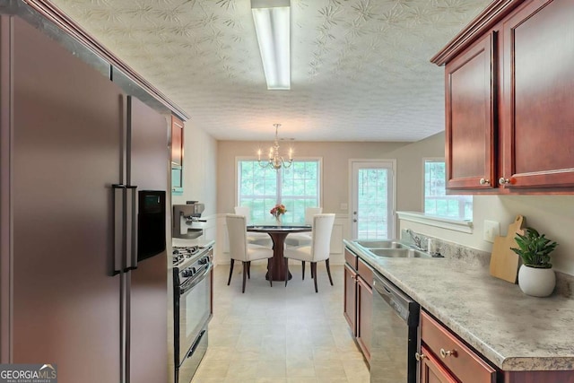 513 Shadow Valley Ct, Lithonia, GA 30058 - kitchen with appliances with stainless steel finishes, a chandelier, dark brown cabinets, hanging light fixtures, and light countertops