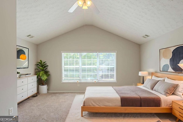 513 Shadow Valley Ct, Lithonia, GA 30058 - bedroom with carpet flooring, a textured ceiling, lofted ceiling, and ceiling fan
