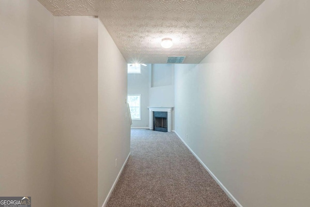 513 Shadow Valley Ct, Lithonia, GA 30058 - hallway featuring carpet floors and a textured ceiling
