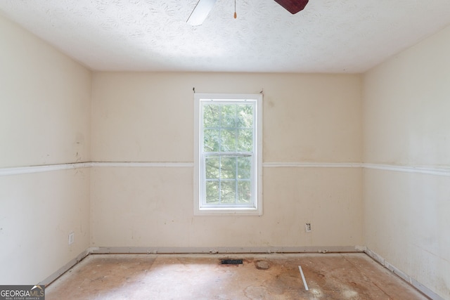 3930 Pine Tree Ln, Gainesville, GA 30501 - spare room with a textured ceiling and ceiling fan