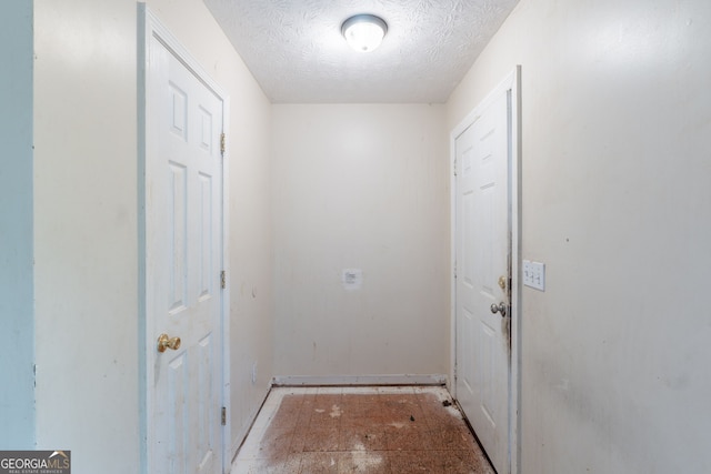 3930 Pine Tree Ln, Gainesville, GA 30501 - entryway featuring a textured ceiling and baseboards