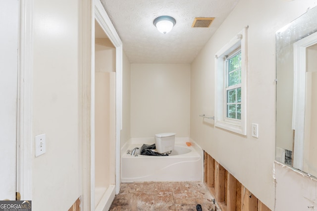 3930 Pine Tree Ln, Gainesville, GA 30501 - full bathroom with a garden tub and a textured ceiling