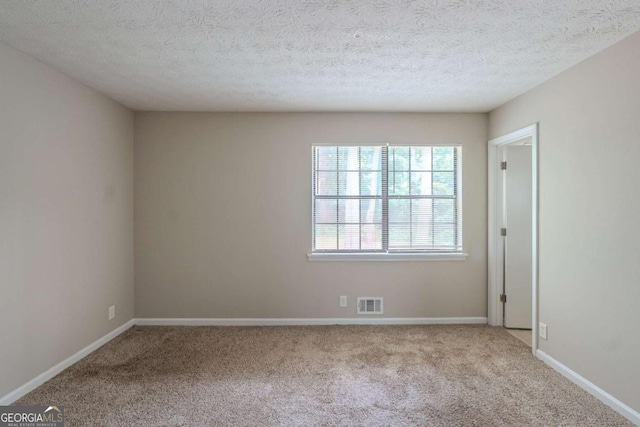 5207 Shawn Ln, Stone Mountain, GA 30088 - unfurnished room featuring carpet flooring and a textured ceiling