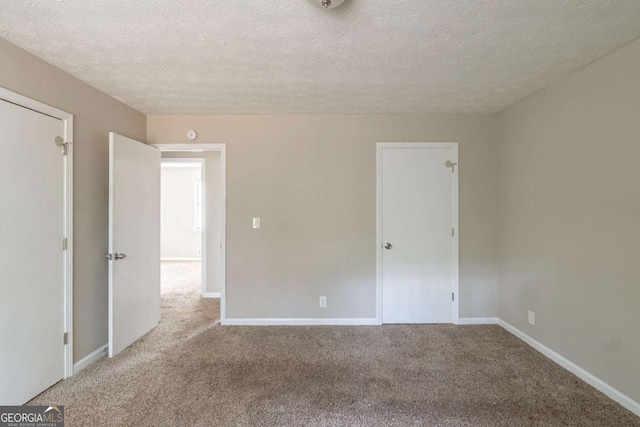 5207 Shawn Ln, Stone Mountain, GA 30088 - spare room with a textured ceiling and carpet floors