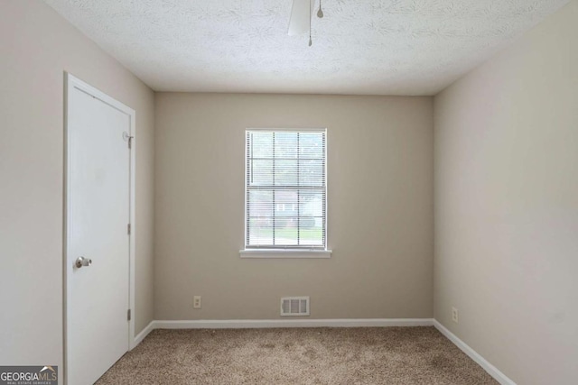 5207 Shawn Ln, Stone Mountain, GA 30088 - carpeted empty room with baseboards and a textured ceiling