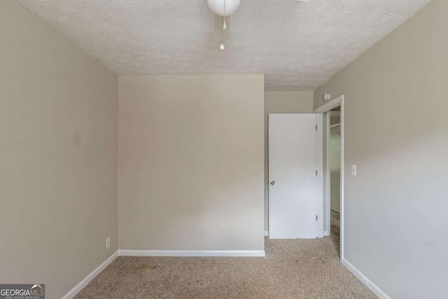 5207 Shawn Ln, Stone Mountain, GA 30088 - unfurnished room featuring carpet floors and a textured ceiling