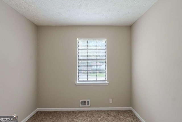 5207 Shawn Ln, Stone Mountain, GA 30088 - carpeted spare room featuring baseboards and a textured ceiling