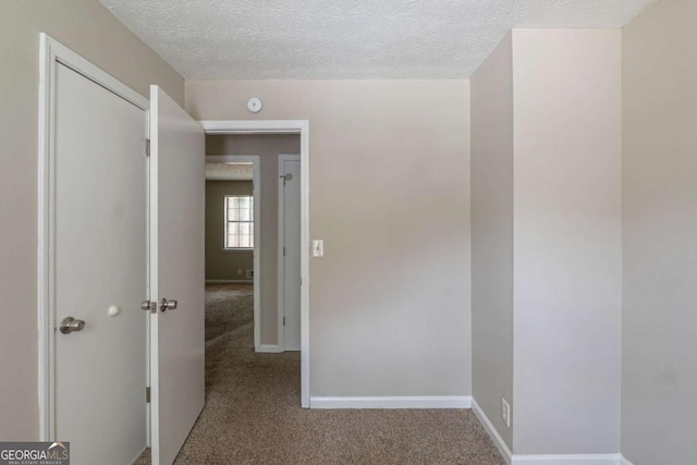 5207 Shawn Ln, Stone Mountain, GA 30088 - hall featuring carpet floors and a textured ceiling
