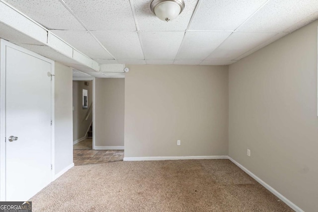 5207 Shawn Ln, Stone Mountain, GA 30088 - carpeted empty room featuring baseboards and a drop ceiling