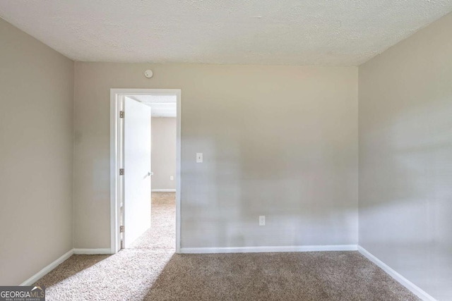5207 Shawn Ln, Stone Mountain, GA 30088 - carpeted spare room with a textured ceiling and a smoke detector