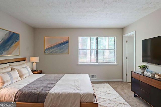 5207 Shawn Ln, Stone Mountain, GA 30088 - bedroom featuring light colored carpet and a textured ceiling