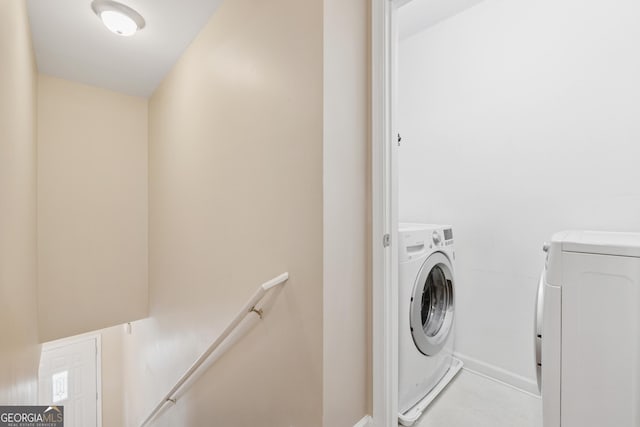 13495 Spring View Dr, Alpharetta, GA 30004 - laundry area with washer and dryer and baseboards