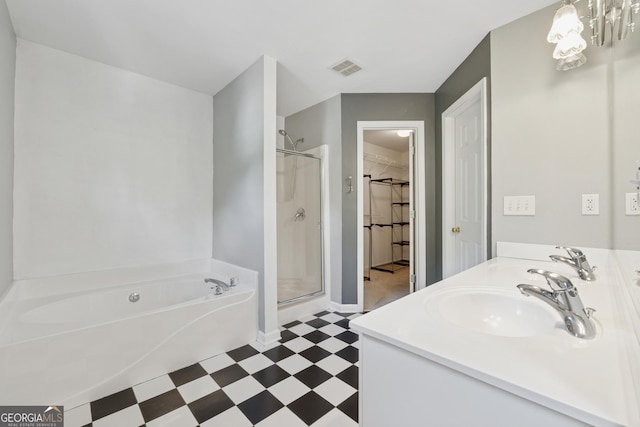 13495 Spring View Dr, Alpharetta, GA 30004 - bathroom featuring tile patterned floors, a bath, a shower stall, double vanity, and a spacious closet