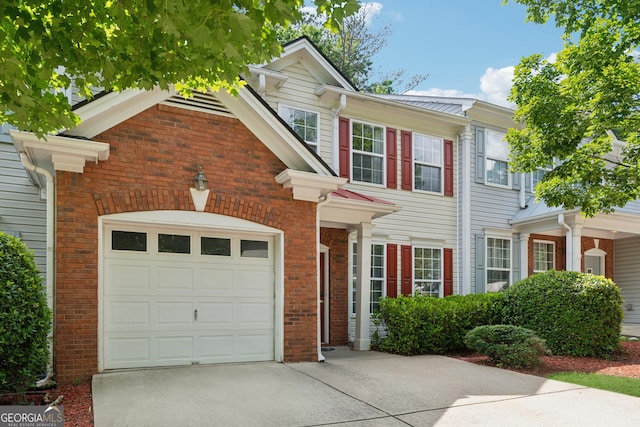 13495 Spring View Dr, Alpharetta, GA 30004 - view of front facade with concrete driveway, a garage, and brick siding