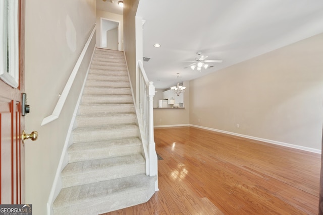 13495 Spring View Dr, Alpharetta, GA 30004 - stairs with a chandelier, wood finished floors, ceiling fan, and recessed lighting
