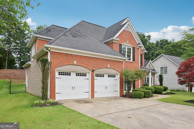 2009 Mclain Rd NW, Acworth, GA 30101 - view of front of home with an attached garage, concrete driveway, and brick siding