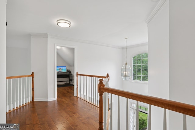 2009 Mclain Rd NW, Acworth, GA 30101 - hallway featuring an upstairs landing, wood-type flooring, crown molding, and a chandelier