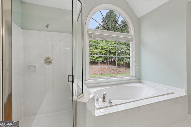 2009 Mclain Rd NW, Acworth, GA 30101 - bathroom with a stall shower, a bath, healthy amount of natural light, and vaulted ceiling