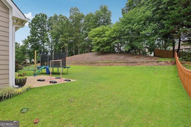 2009 Mclain Rd NW, Acworth, GA 30101 - view of yard with a trampoline and a patio area
