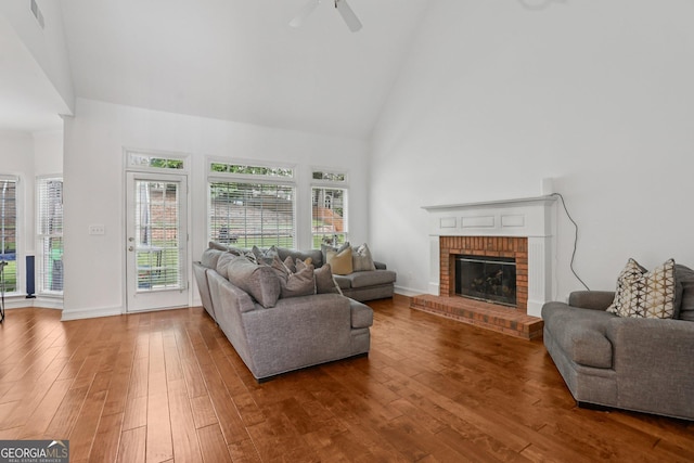 2009 Mclain Rd NW, Acworth, GA 30101 - living area featuring high vaulted ceiling, hardwood / wood-style flooring, a fireplace, plenty of natural light, and a ceiling fan