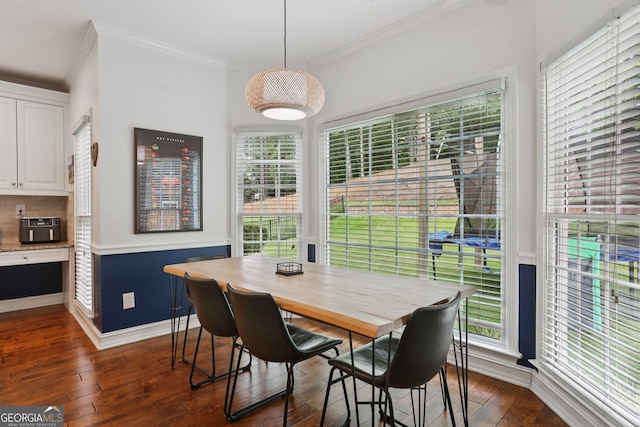 2009 Mclain Rd NW, Acworth, GA 30101 - dining room featuring crown molding and dark wood-style flooring