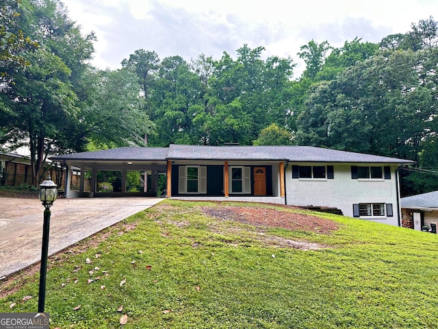6456 Wright Rd NE, Atlanta, GA 30328 - view of front of property with driveway, an attached carport, a front yard, and brick siding