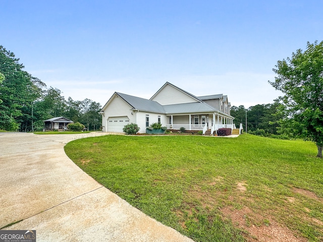 735 Firetower Rd, Thomaston, GA 30286 - view of front facade featuring covered porch, driveway, a front yard, and an attached garage