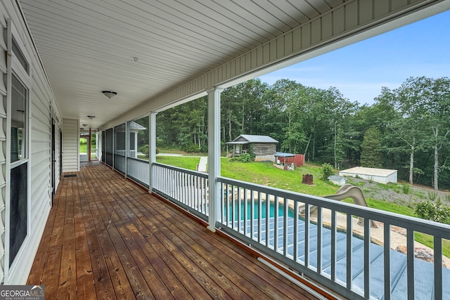 735 Firetower Rd, Thomaston, GA 30286 - wooden terrace with an outbuilding, an outdoor pool, and a yard