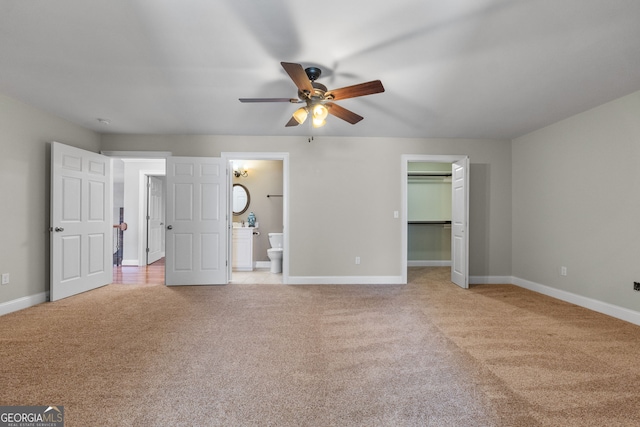 735 Firetower Rd, Thomaston, GA 30286 - unfurnished bedroom with light colored carpet, ensuite bath, and ceiling fan