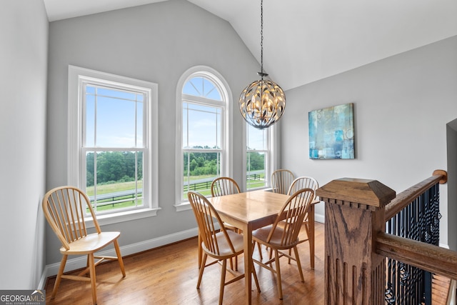735 Firetower Rd, Thomaston, GA 30286 - dining room with a chandelier, vaulted ceiling, and wood finished floors