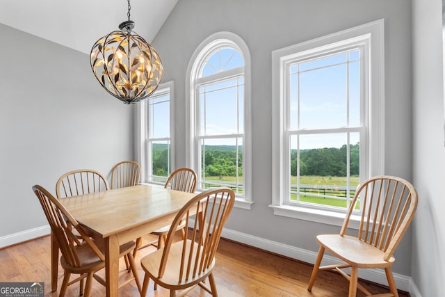 735 Firetower Rd, Thomaston, GA 30286 - dining space featuring a chandelier, light wood-style flooring, and lofted ceiling