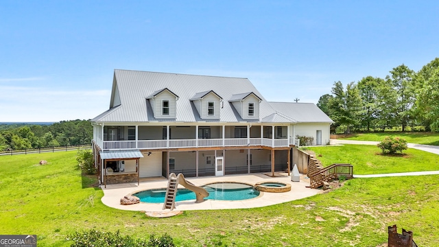735 Firetower Rd, Thomaston, GA 30286 - rear view of property featuring a sunroom, a patio area, and a pool with connected hot tub