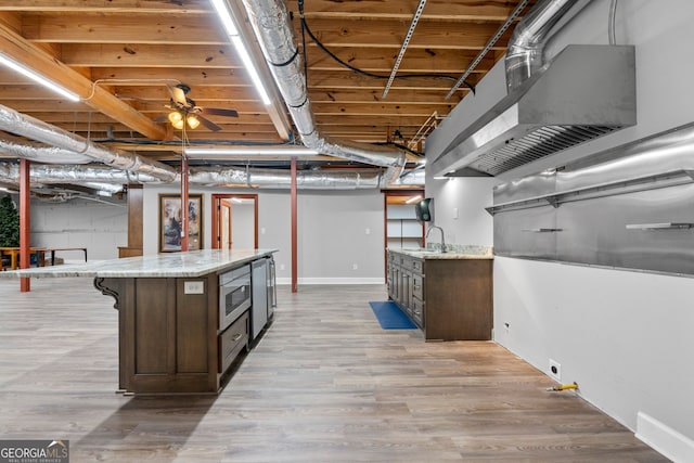 735 Firetower Rd, Thomaston, GA 30286 - finished basement featuring a sink and light wood-style floors