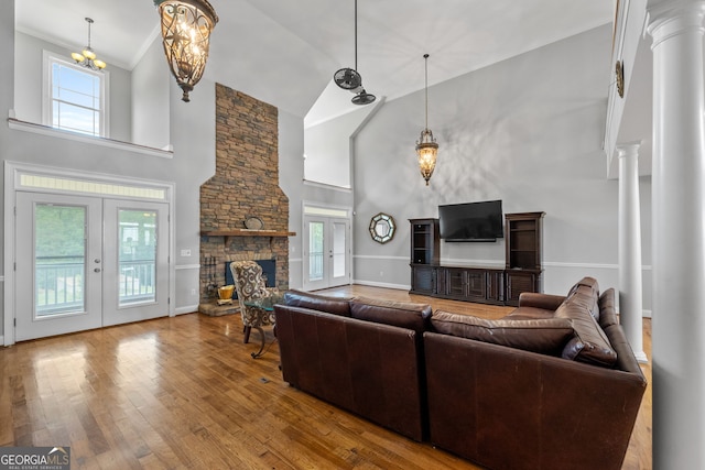 735 Firetower Rd, Thomaston, GA 30286 - living room with high vaulted ceiling, plenty of natural light, hardwood / wood-style flooring, and ornate columns