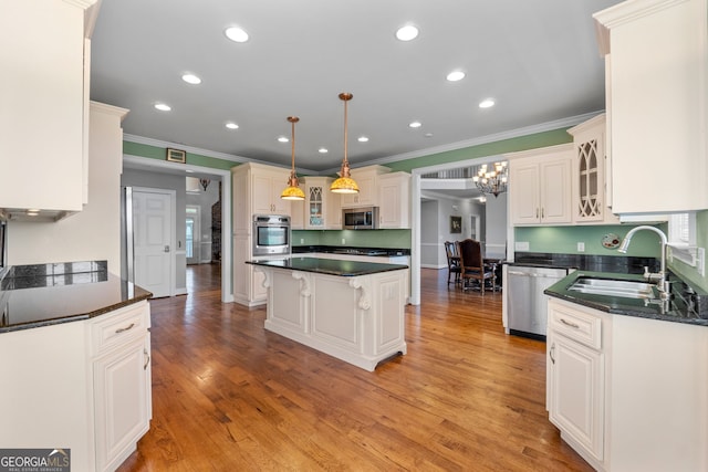 735 Firetower Rd, Thomaston, GA 30286 - kitchen featuring stainless steel appliances, crown molding, a center island, recessed lighting, and a kitchen breakfast bar