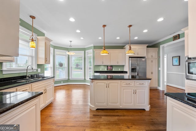 735 Firetower Rd, Thomaston, GA 30286 - kitchen with stainless steel appliances, healthy amount of natural light, crown molding, light wood finished floors, and recessed lighting