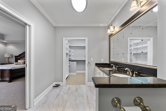 735 Firetower Rd, Thomaston, GA 30286 - full bathroom with double vanity, ensuite bath, crown molding, marble finish flooring, and a spacious closet