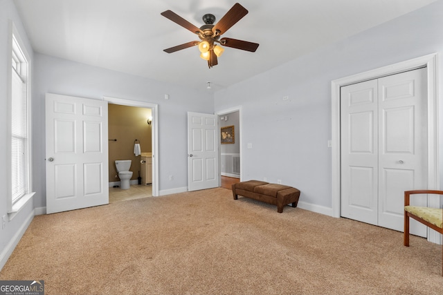 735 Firetower Rd, Thomaston, GA 30286 - unfurnished bedroom featuring carpet, a closet, multiple windows, and connected bathroom
