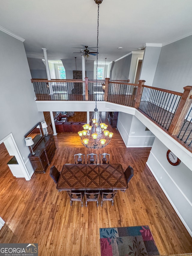 735 Firetower Rd, Thomaston, GA 30286 - living room featuring ceiling fan, crown molding, wood finished floors, ornate columns, and a chandelier