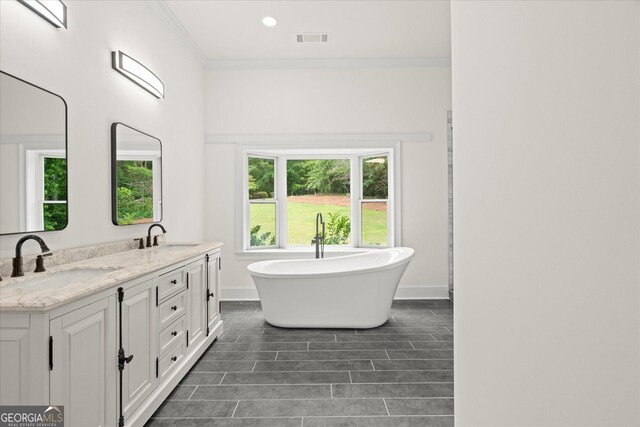 85 Geralds Pt, Wedowee, AL 36278 - full bathroom with double vanity, a freestanding bath, and ornamental molding