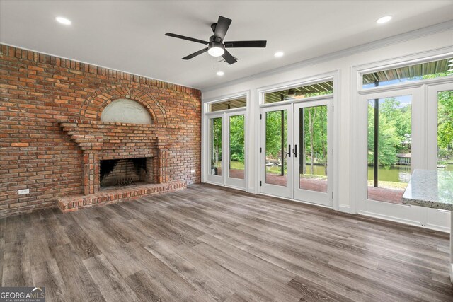 85 Geralds Pt, Wedowee, AL 36278 - unfurnished living room featuring a ceiling fan, a fireplace, wood finished floors, french doors, and recessed lighting