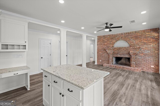 85 Geralds Pt, Wedowee, AL 36278 - kitchen with ceiling fan, dark wood-style flooring, a brick fireplace, white cabinetry, and recessed lighting