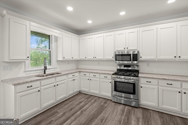 85 Geralds Pt, Wedowee, AL 36278 - kitchen with stainless steel appliances, white cabinets, wood finished floors, recessed lighting, and light stone countertops