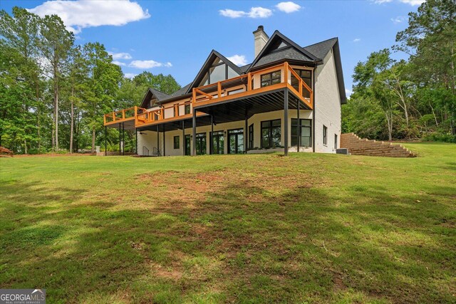 85 Geralds Pt, Wedowee, AL 36278 - rear view of property featuring a yard, a wooden deck, a chimney, and stucco siding