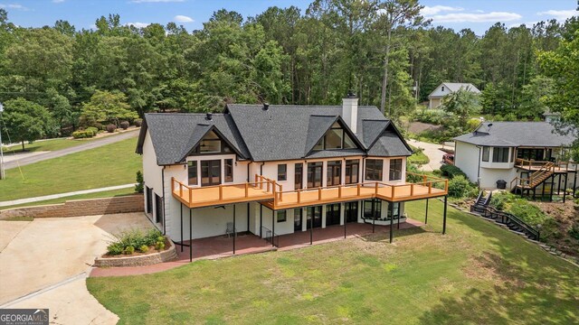 85 Geralds Pt, Wedowee, AL 36278 - back of house with stucco siding, roof with shingles, a yard, a chimney, and a deck