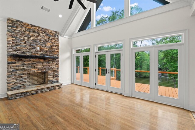 85 Geralds Pt, Wedowee, AL 36278 - unfurnished living room with a ceiling fan, high vaulted ceiling, wood finished floors, beam ceiling, and french doors