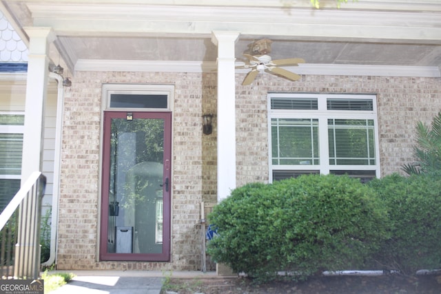 6127 Landers Loop, Fairburn, GA 30213 - doorway to property featuring ceiling fan and brick siding